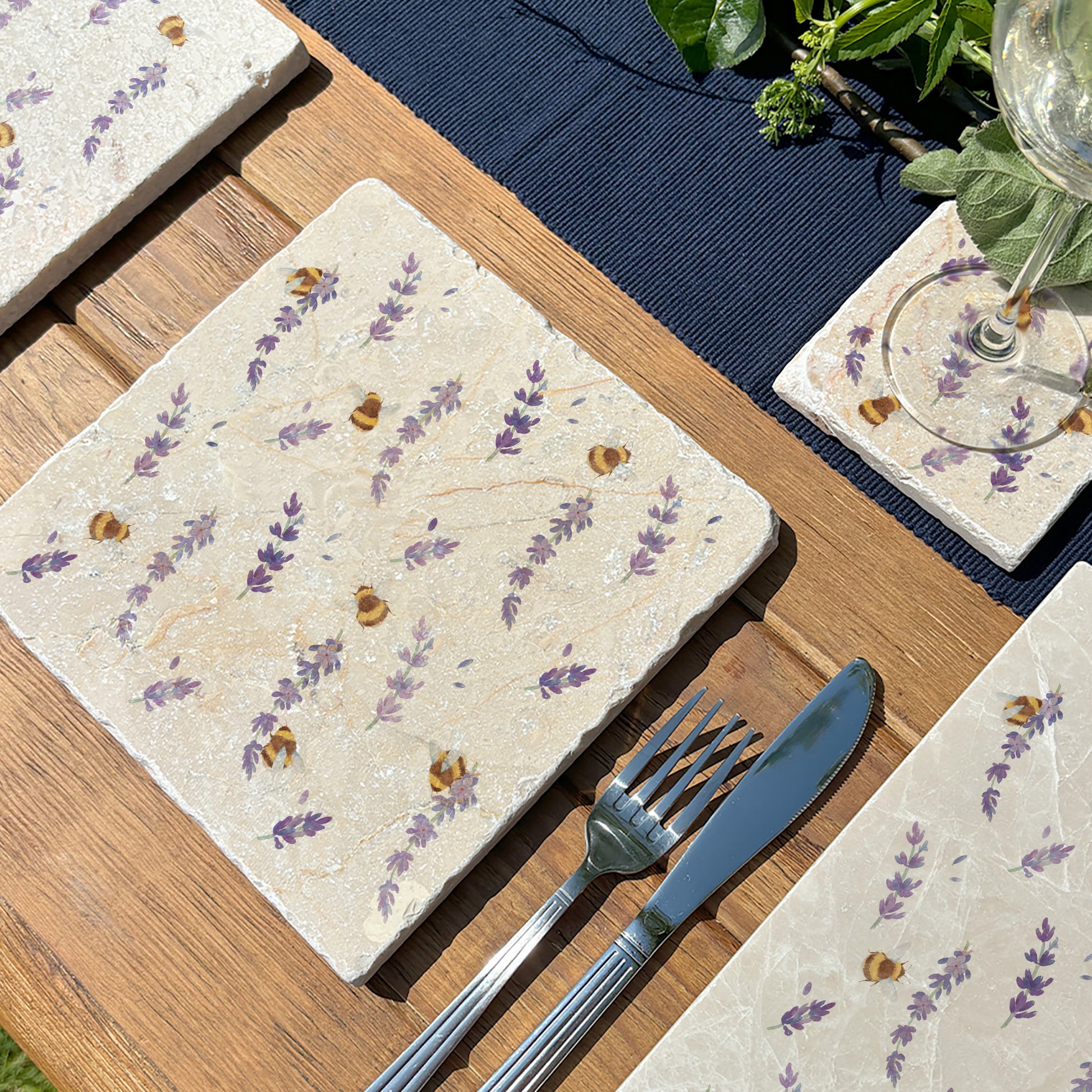 A handmade medium marble platter featuring a beautiful pattern of busy bees and purple lavender flowers.