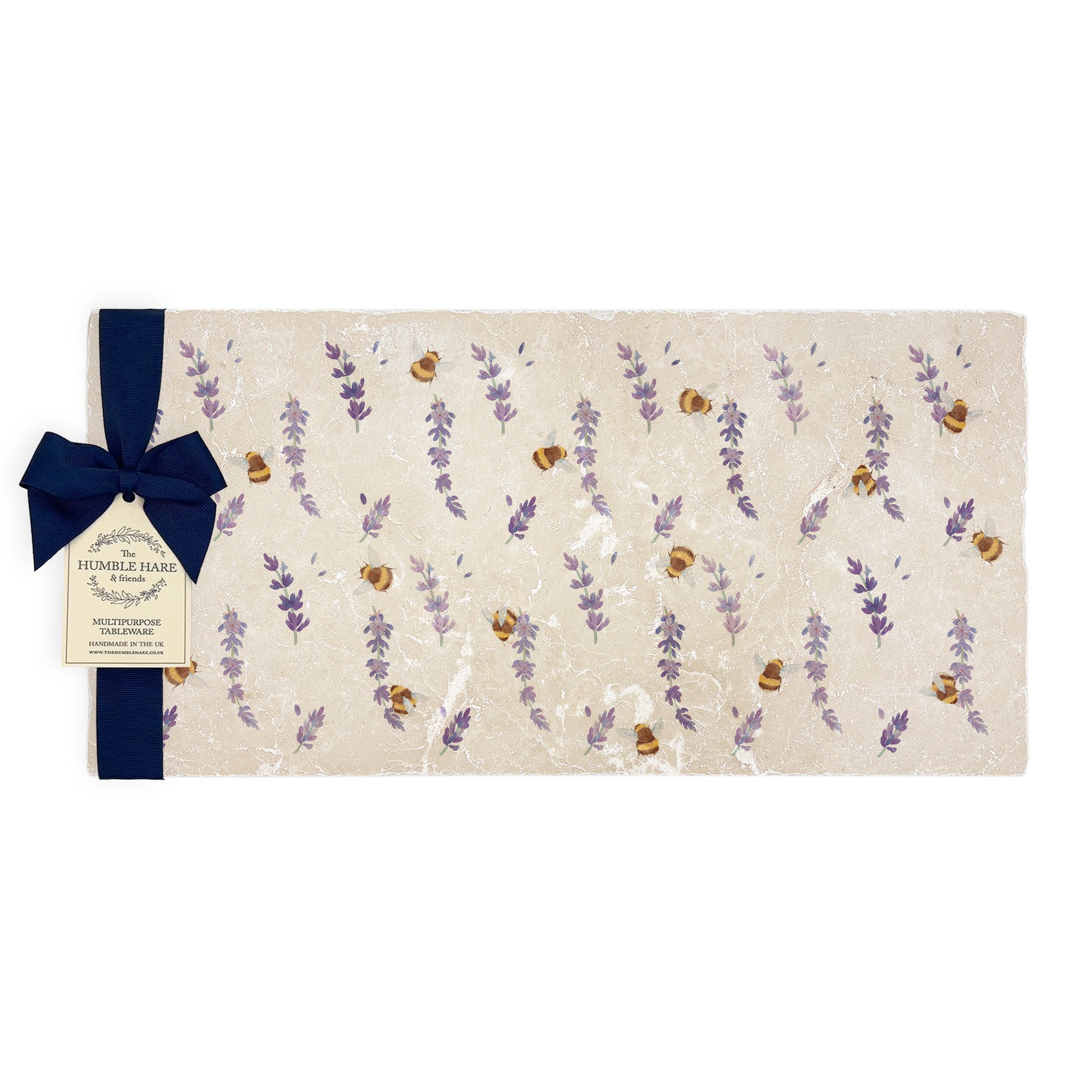 A multipurpose marble sharing platter with a watercolour lavender and bee pattern, packaged with a luxurious dark blue bow and branded gift tag.