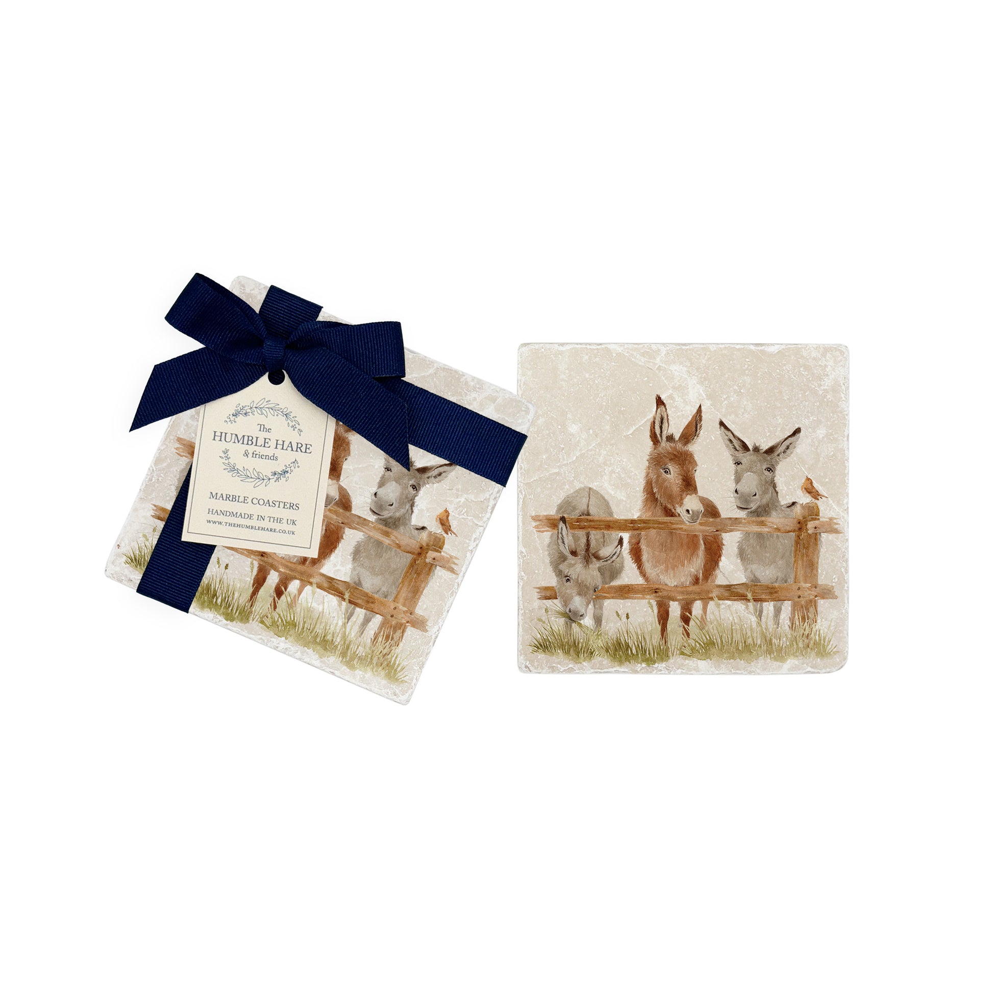 A pair of marble coasters featuring a watercolour donkey design, and a luxurious blue gift bow.