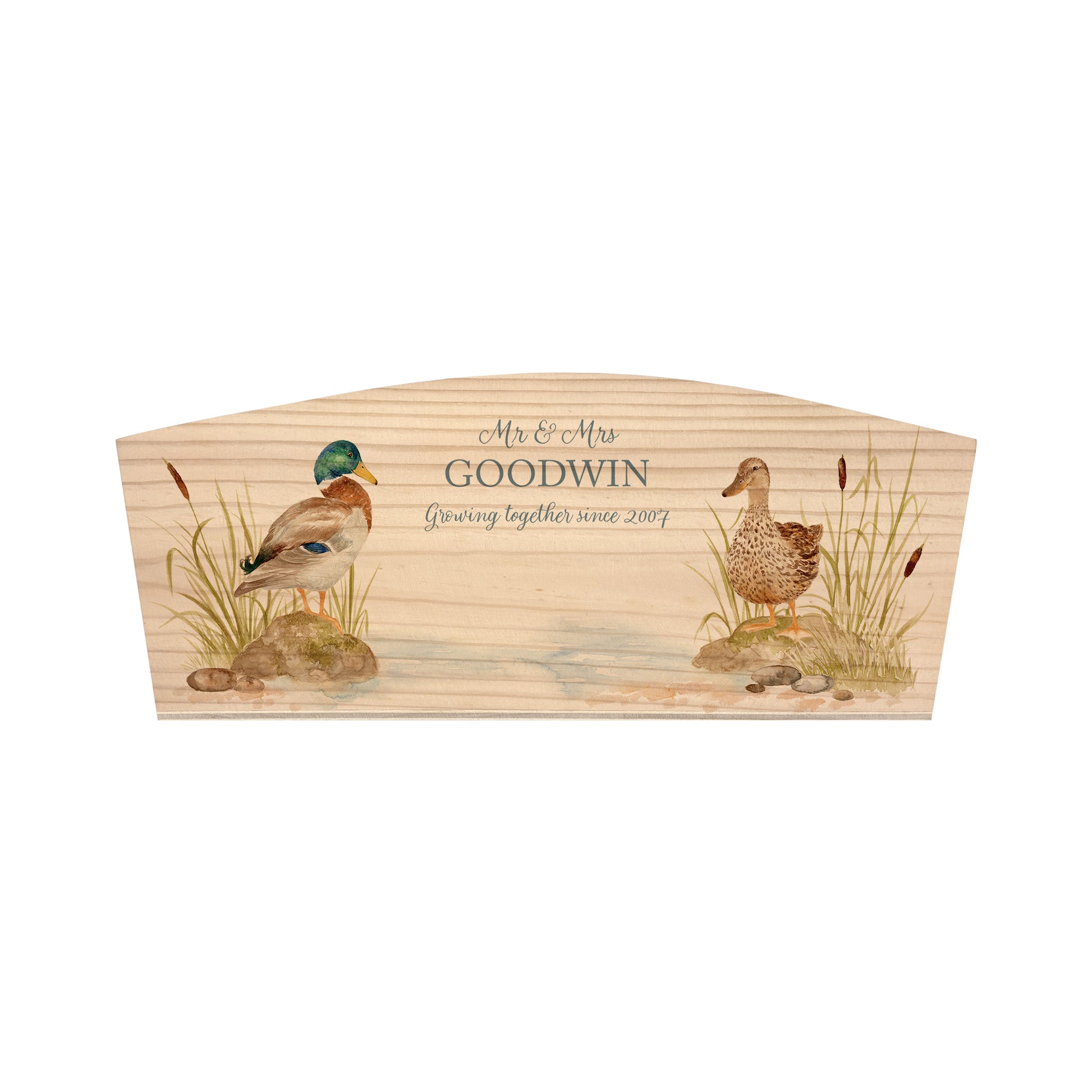 An arched wooden planter box with a watercolour design of two mallard ducks by the pond. The planter is an ideal gift for gardening enthusiasts, and can be personalised with a selection of phrases and custom names, dates and house number or name.
