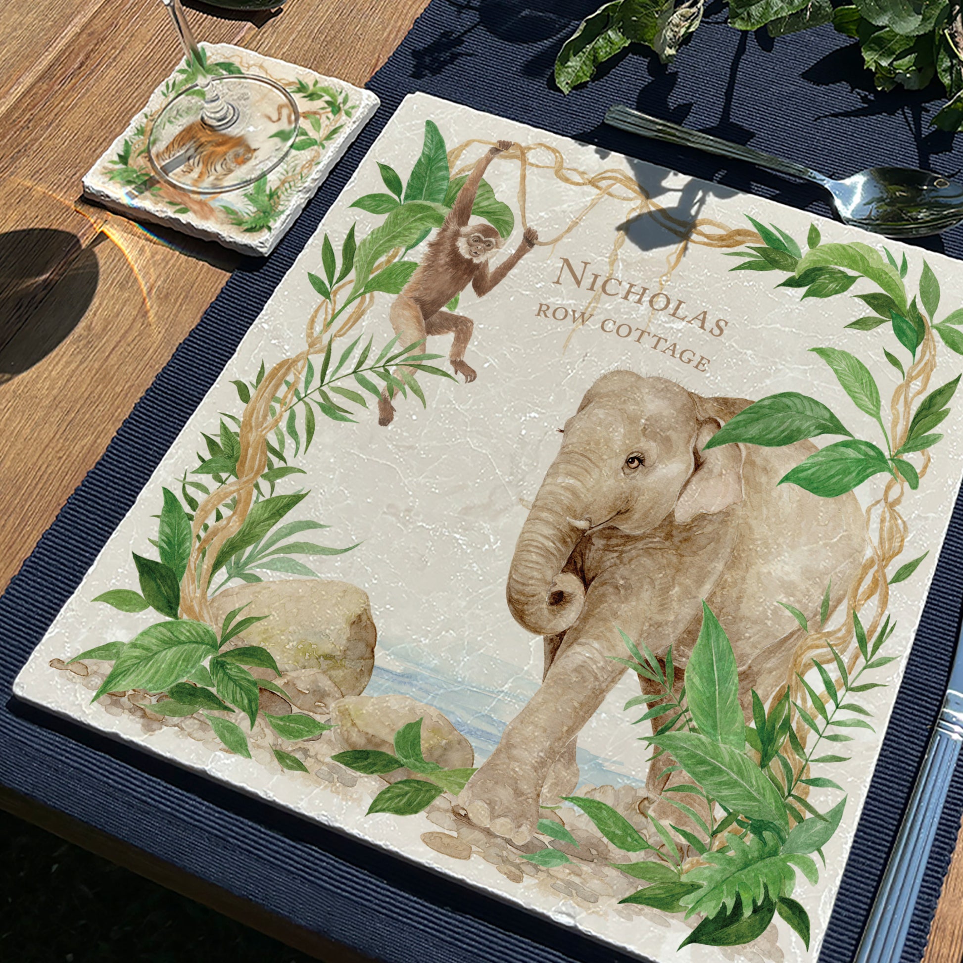 A personalised marble large platter with a rainforest elephant and gibbon watercolour design. Create a personalised placemat, serving platter, trivet or cheeseboard as a luxury gift.