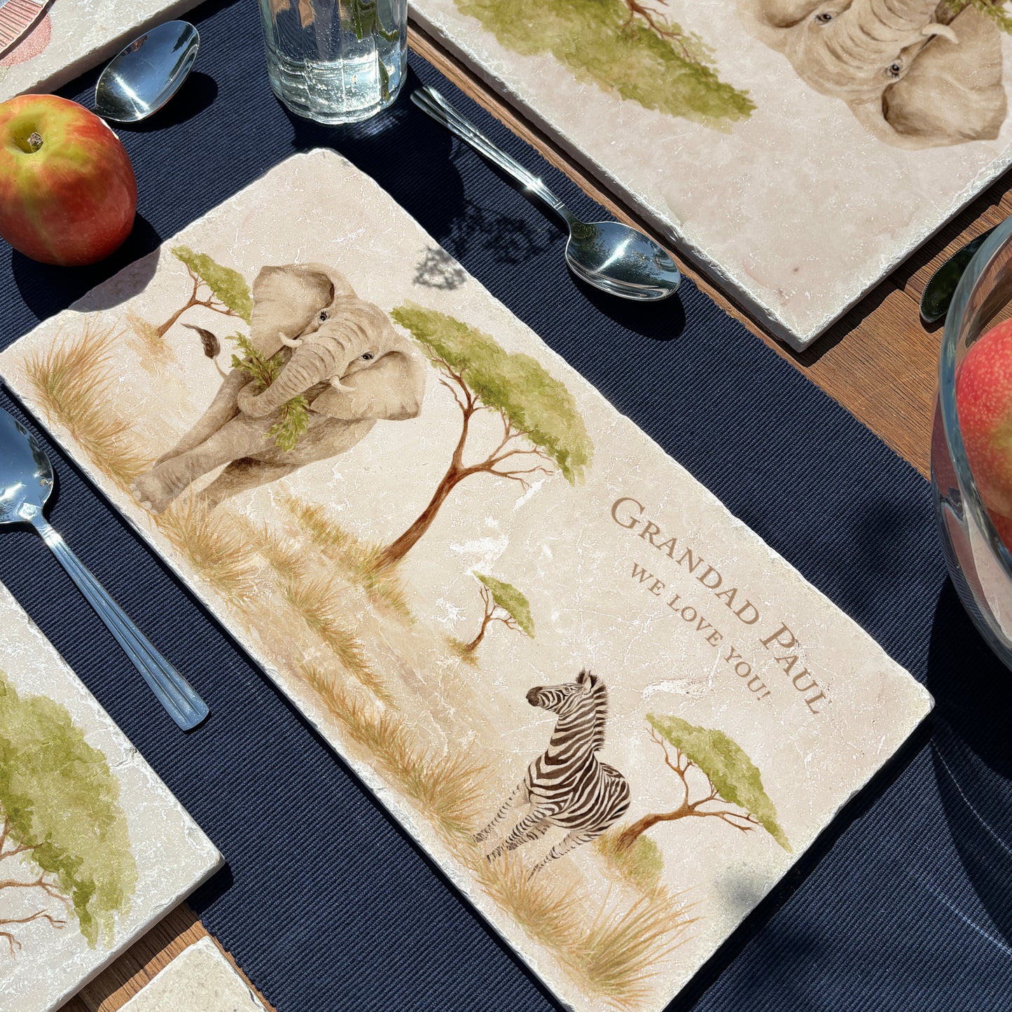 A personalised marble sharing platter with an African elephant and zebra safari watercolour design. Create a personalised serving platter, trivet or cheeseboard as a luxury gift.