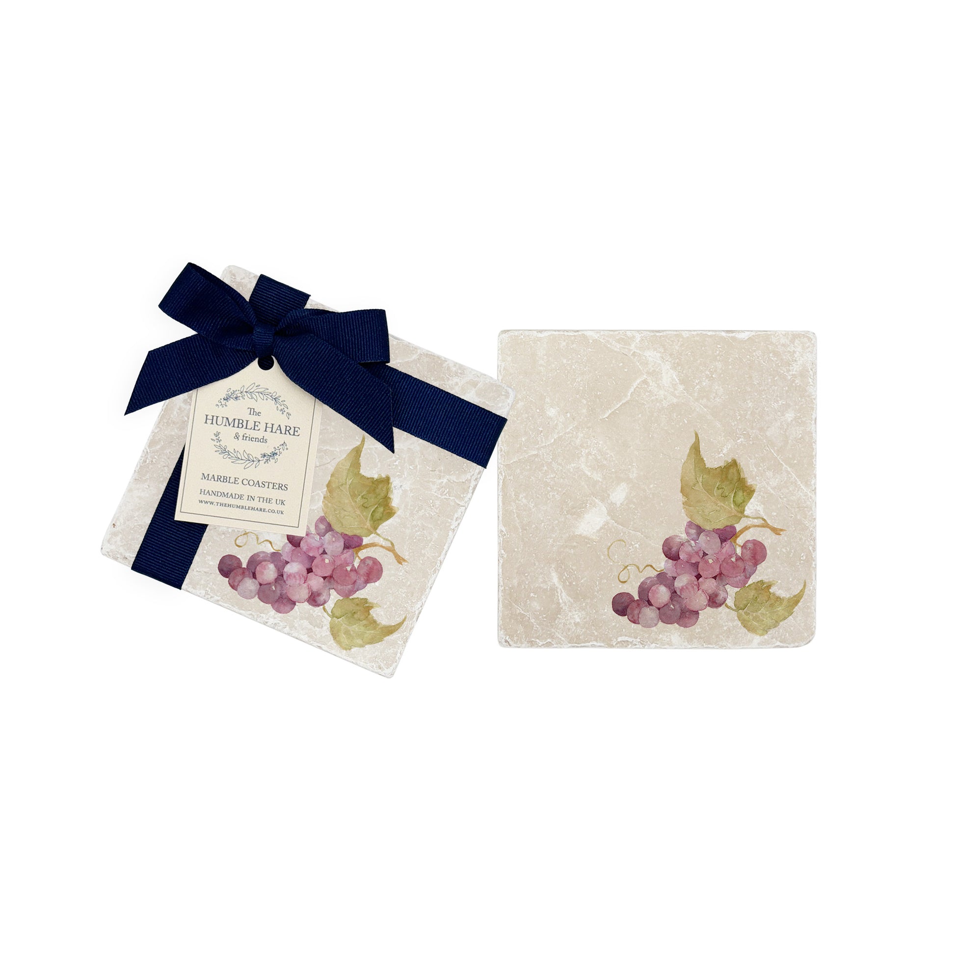 A pair of marble platters with a watercolour grape design. The coasters have a luxurious blue bow.