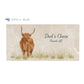A personalised rectangular marble sharing platter featuring a highland cow in a watercolour style. The example personalised dark blue text reads ‘Dad's Cheese, Hands off!’ in a brush script font.