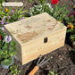 This medium sized wooden pine New home gift box can be filled with special gifts as a new home special occasion. The Design has a blue tit, robin, wren and sparrow on branches. There is a flying sparrow carrying a new home bunting. There is also a beautiful wooden gate opening to symbolise new beginnings with the gate opening. In the Garden new home gift.