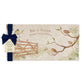 A personalised marble sharing platter featuring garden birds in the hedgerow around a paddock gate in a watercolour style, packaged with a luxurious dark blue bow and branded gift tag.