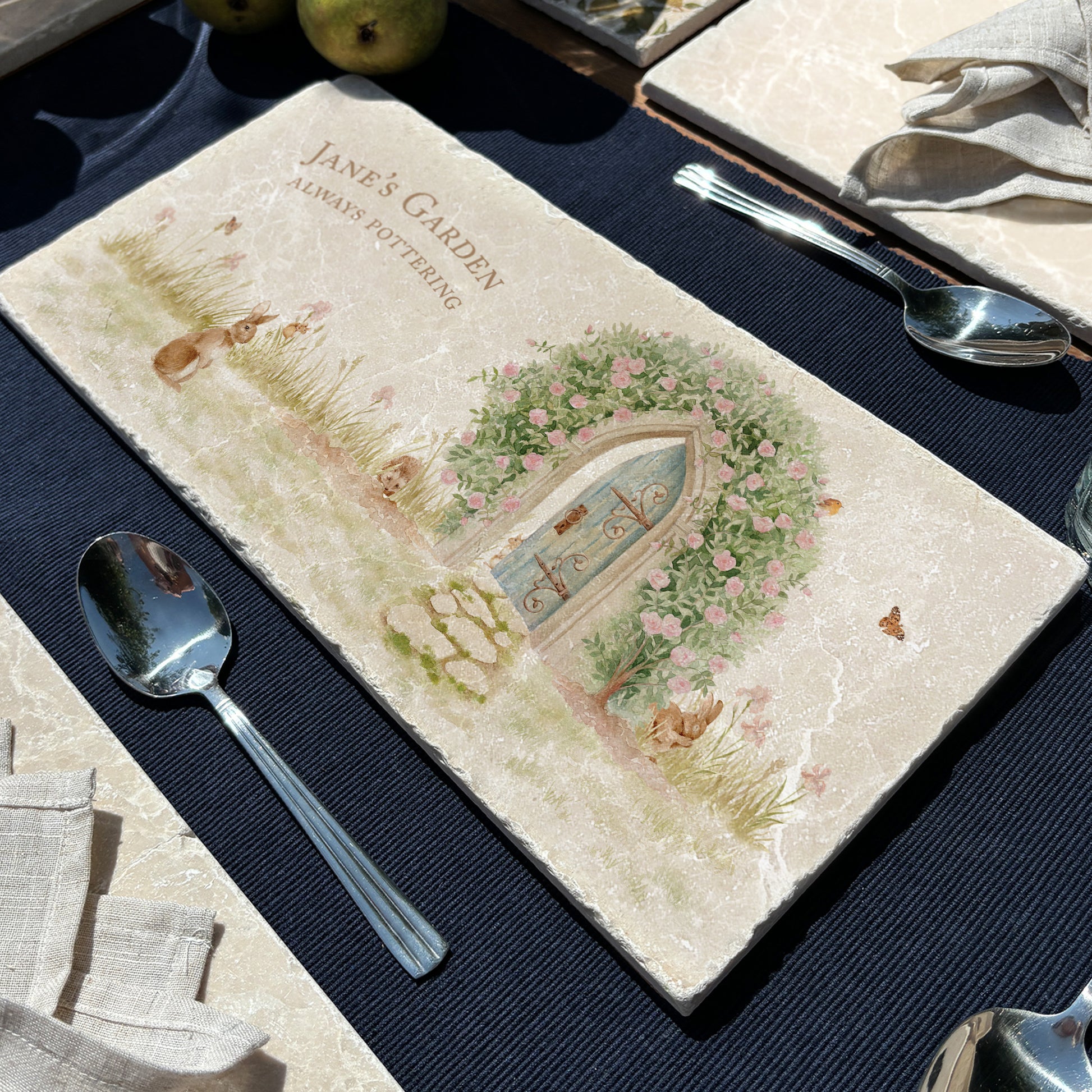 A personalised marble sharing platter with a hidden garden rose arch watercolour design with woodland animals. Create a personalised serving platter, trivet or cheeseboard as a luxury gift.