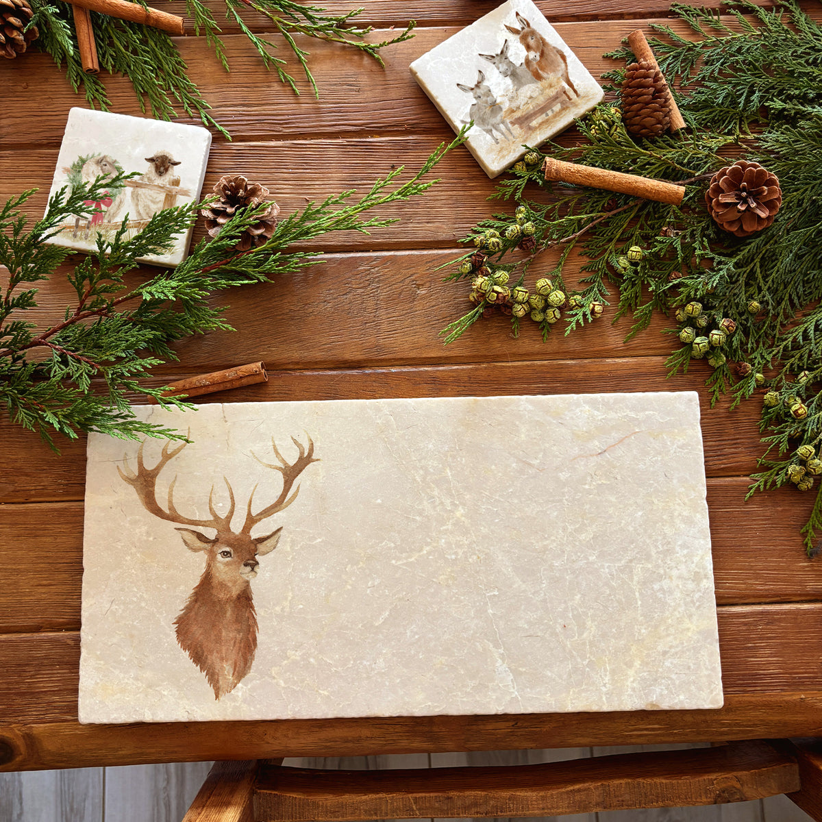 A marble sharing platter featuring a watercolour portrait of a majestic stag.