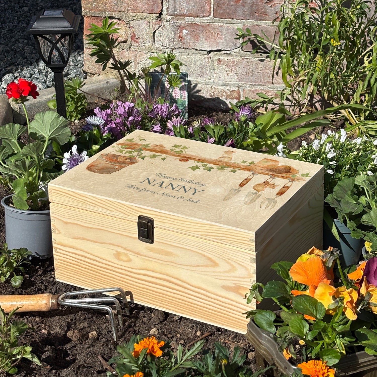 Large wooden pine gift box, The perfect Personalised keepsake, memory box, storage box with  some mischievous mice playing on a wooden shelf filled with gardening tools and plant pots, there is also a small snail on the shelf. The design  features our classic gentle watercolour style.  Carry around the most special treasured items stored in a unique way. 