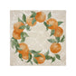 A large square marble placemat, featuring a rustic oranges and leaves wreath design.