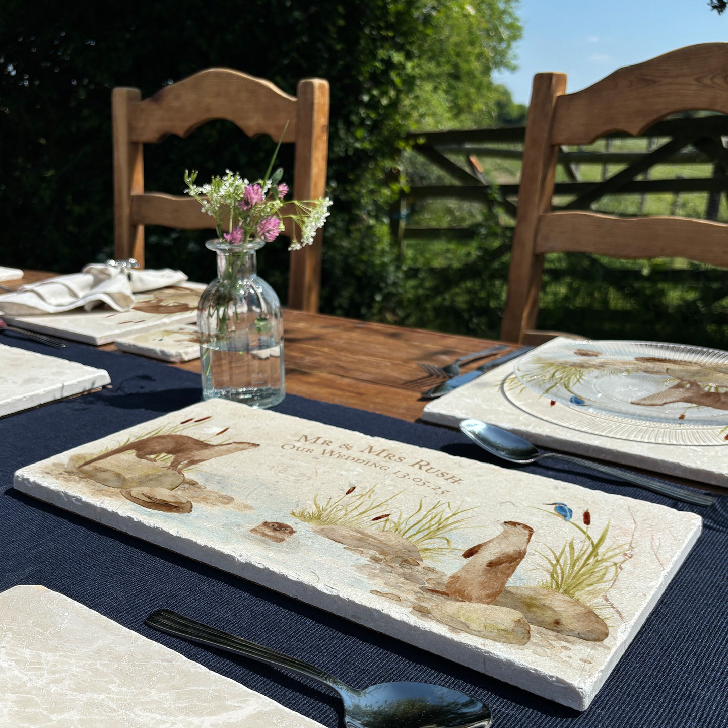 A personalised marble sharing platter with an otter and kingfisher river bank watercolour design. Create a personalised serving platter, trivet or cheeseboard as a luxury gift.