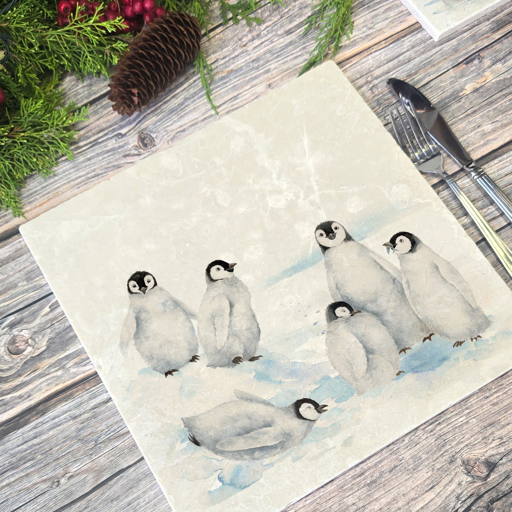 Beautiful Penguin family huddled together on our best selling Large Platter they are in a snowy Antarctica the perfect gift finished with a blue ribbon.  