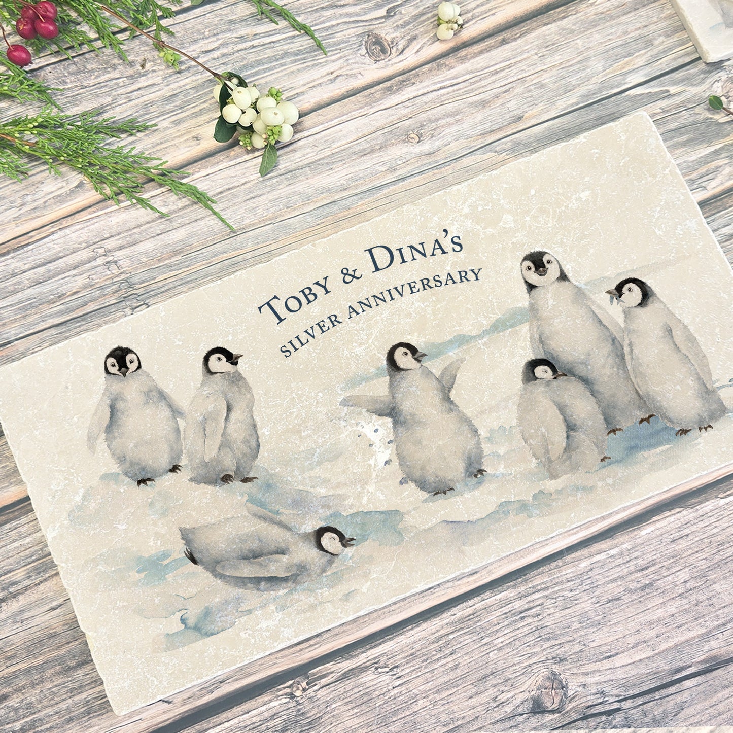 A personalised marble sharing platter with a penguin watercolour design. Create a personalised serving platter, trivet or cheeseboard as a luxury gift.
