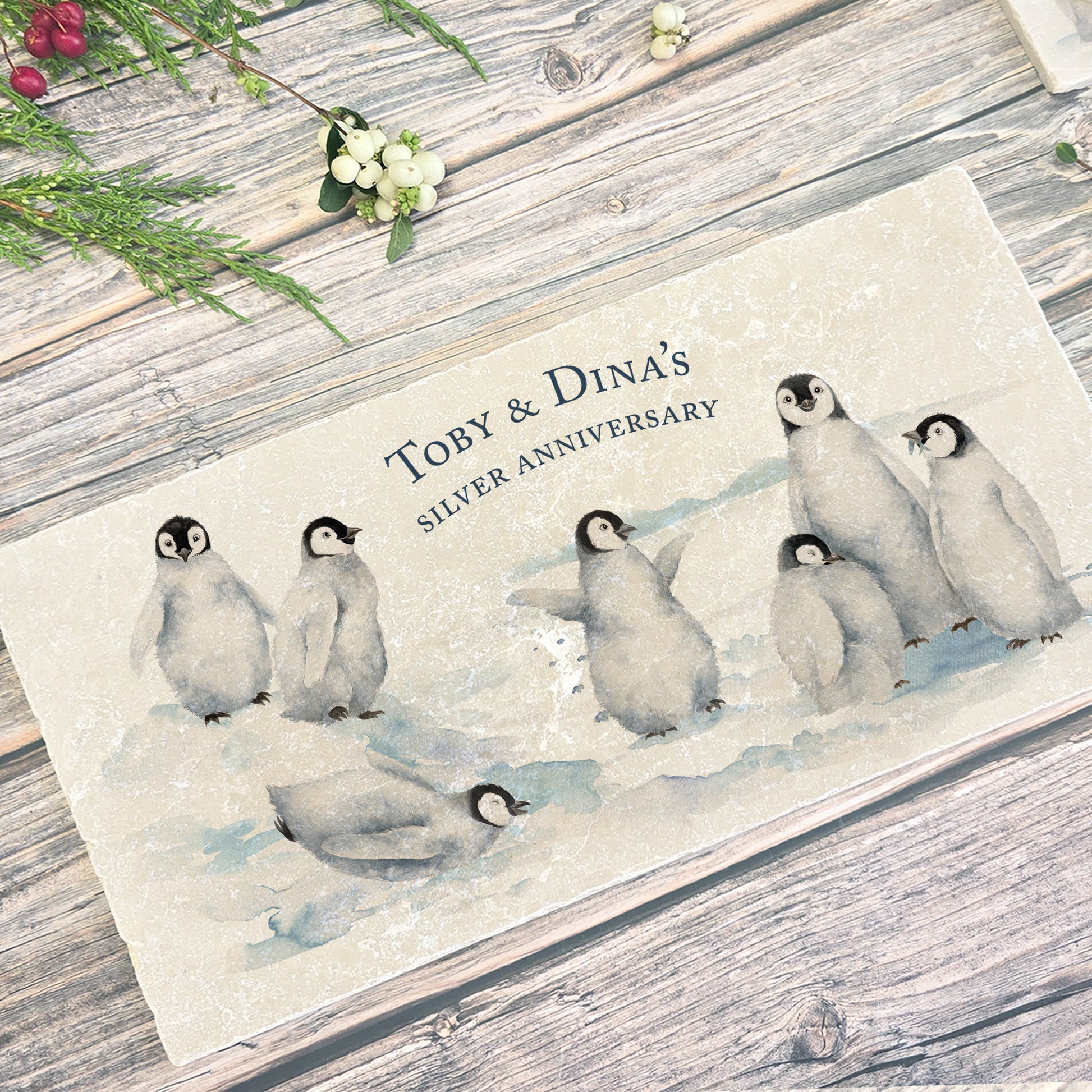 A personalised marble sharing platter with a penguin watercolour design. Create a personalised serving platter, trivet or cheeseboard as a luxury gift.