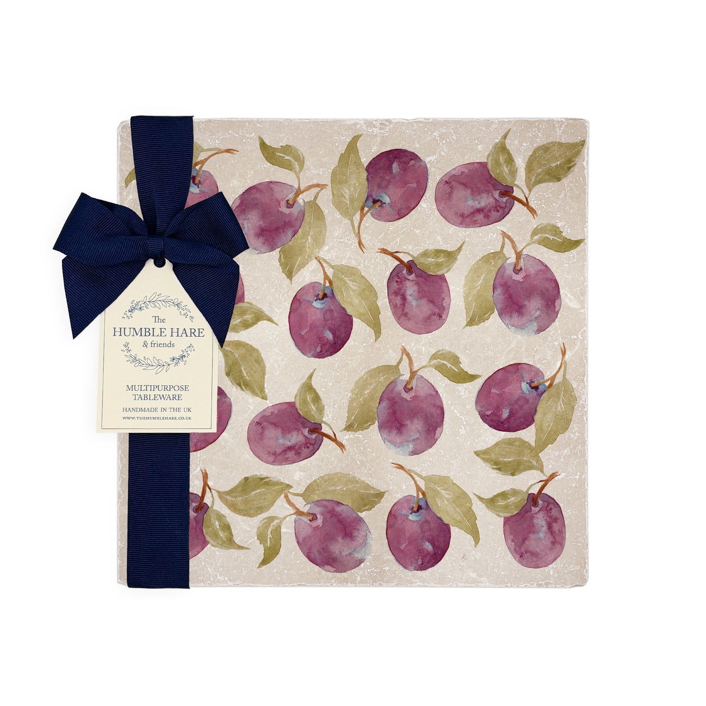 A square medium multipurpose platter used as a side plate on an outdoor dining table. The platter features a maximalist plum pattern.