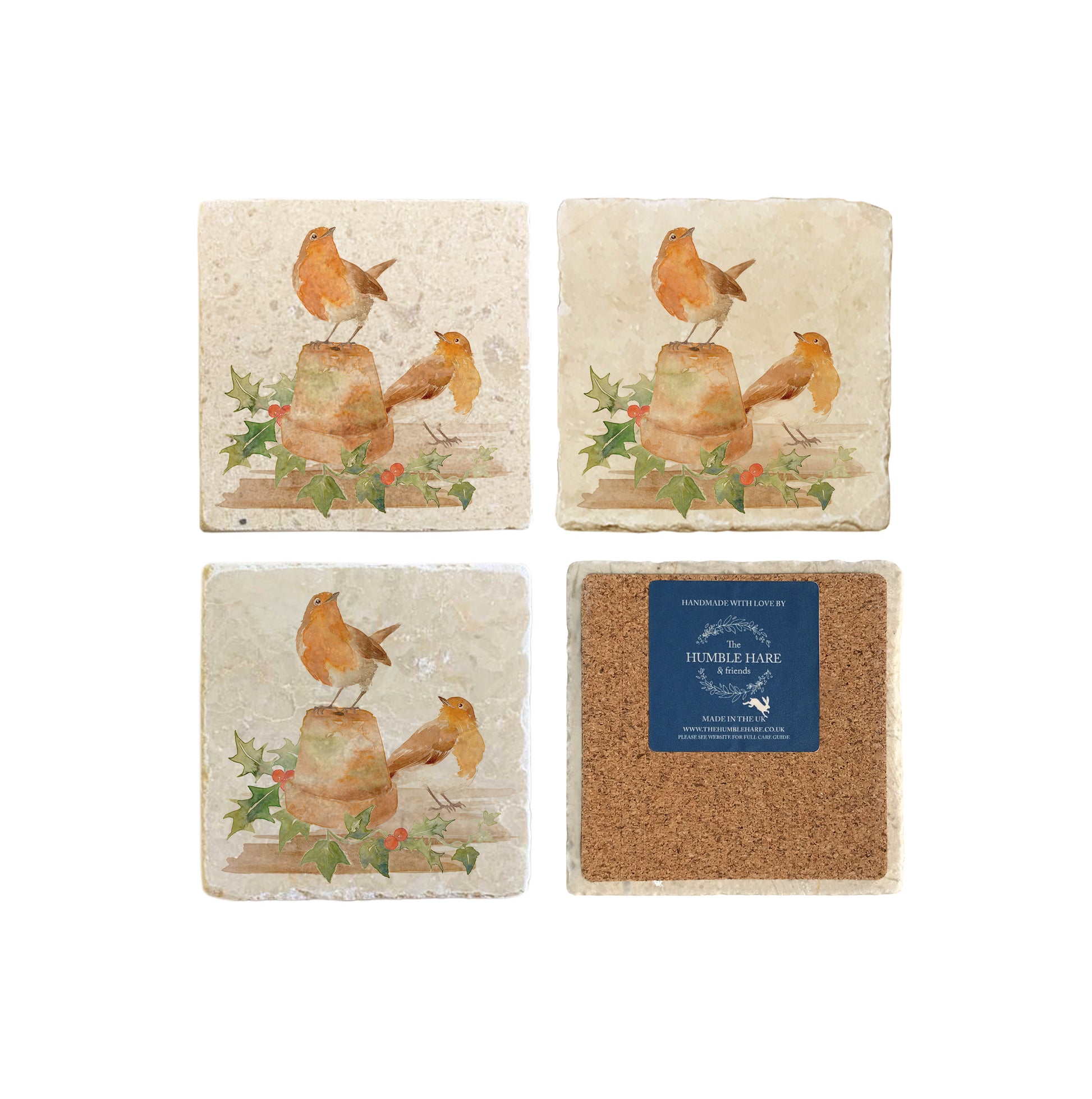 A set of 4 handmade marble coasters, featuring a watercolour Christmas robin design. One coaster is flipped to show that the coasters are backed with cork.