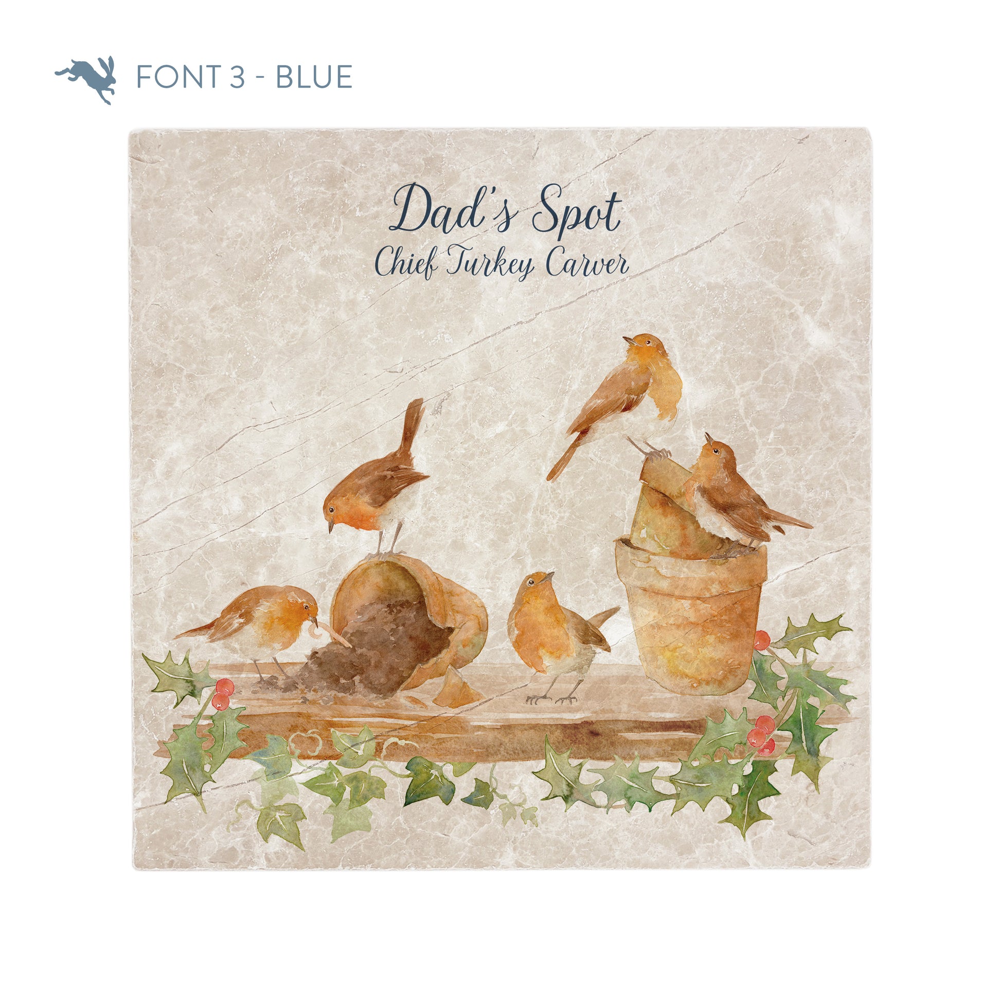 A large square personalised marble placemat with a Christmas robin and holly design. The placemat is personalised with 'Dad's Spot, Chief Turkey Carver' at the top in a blue brush script font.