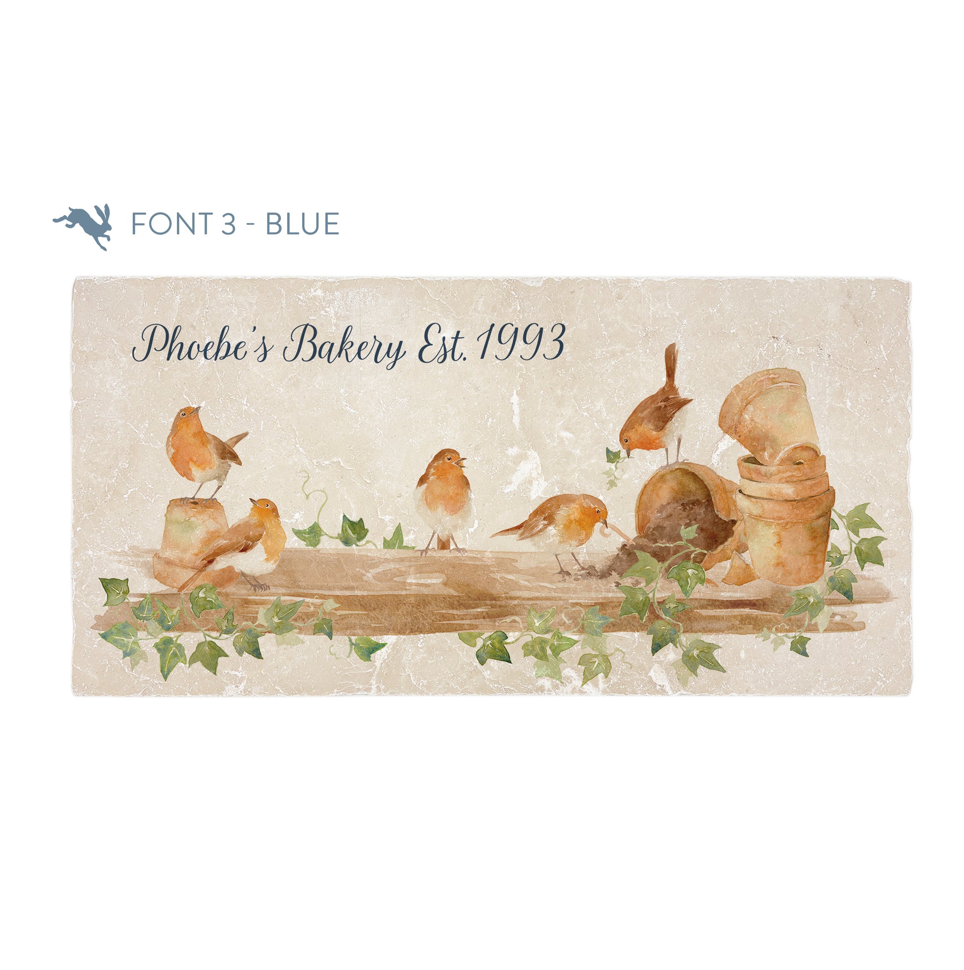A personalised rectangular marble sharing platter featuring a group of robins up to mischief in a watercolour style. The example personalised dark blue text reads ‘Phoebe's Bakery Est. 1993’ in a brush script font.