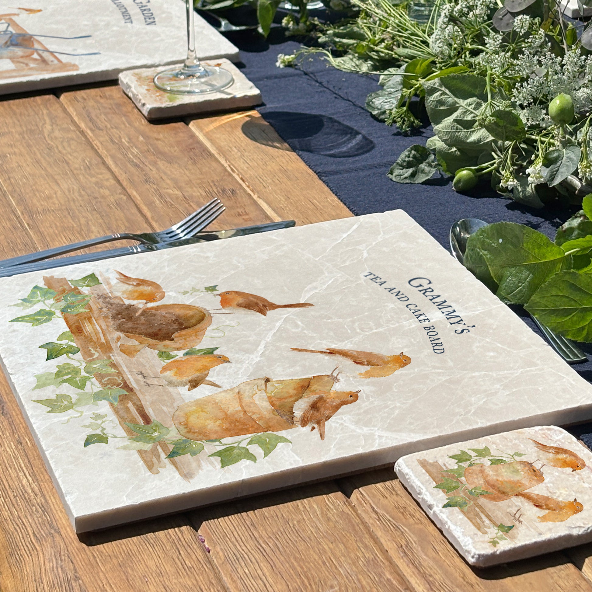 A personalised marble large platter with a robins in the potting shed watercolour design. Create a personalised placemat, serving platter, trivet or cheeseboard as a luxury gift.