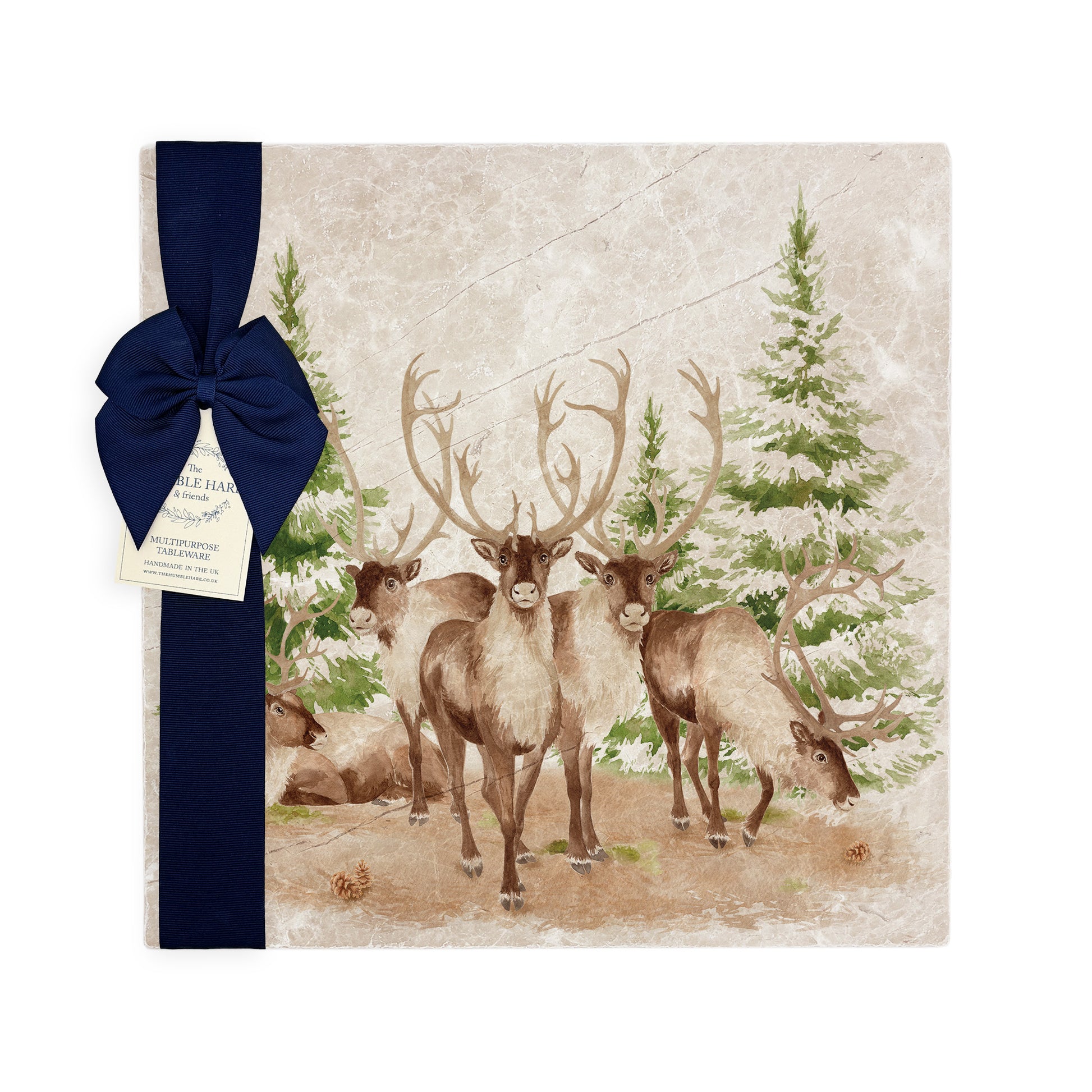 The Reindeers rest design features reindeer appearing from an opening in the wintery snowy forest. 