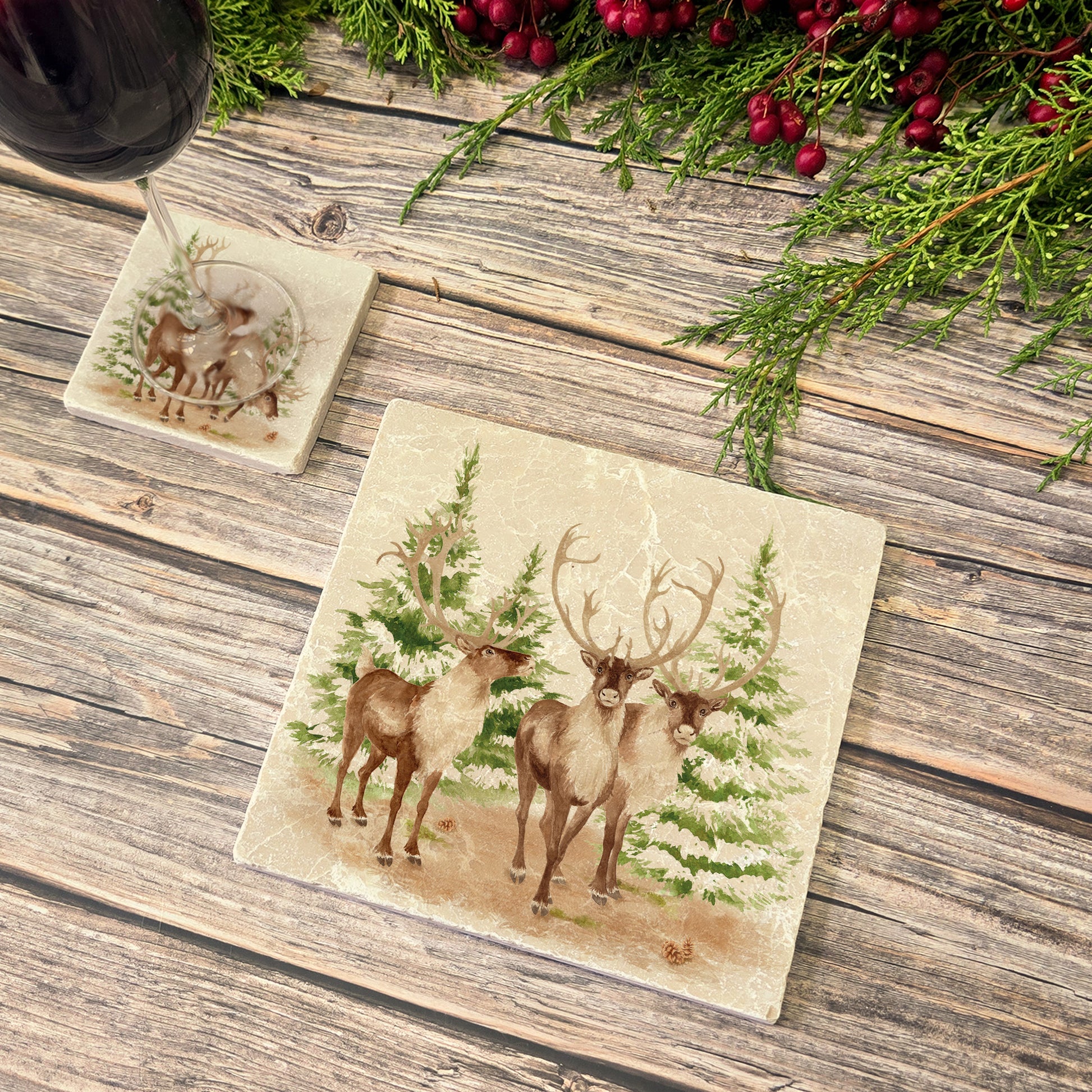The Reindeers rest design features reindeer appearing from an opening in the wintery snowy forest. 