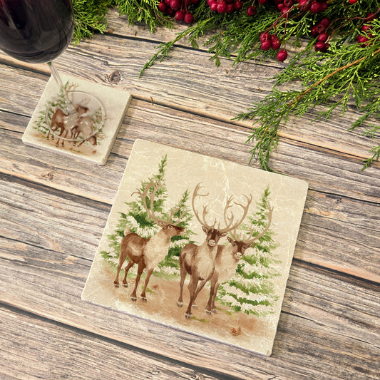 The Reindeers rest design features reindeer appearing from an opening in the wintery snowy forest. 