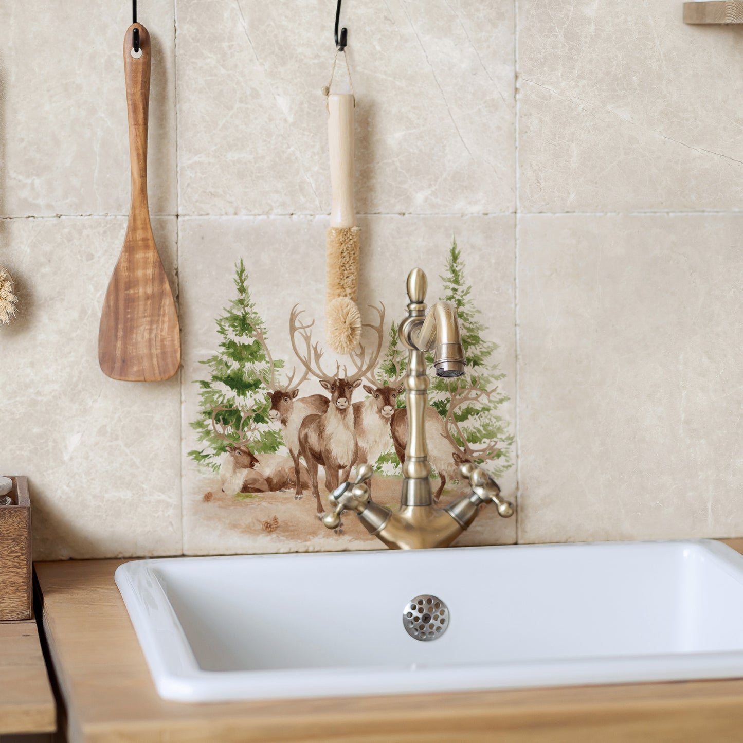 A group of Reindeer resting surrounded by snowy pine trees. The perfect centrepiece for a show stopping Kitchen Renovation 