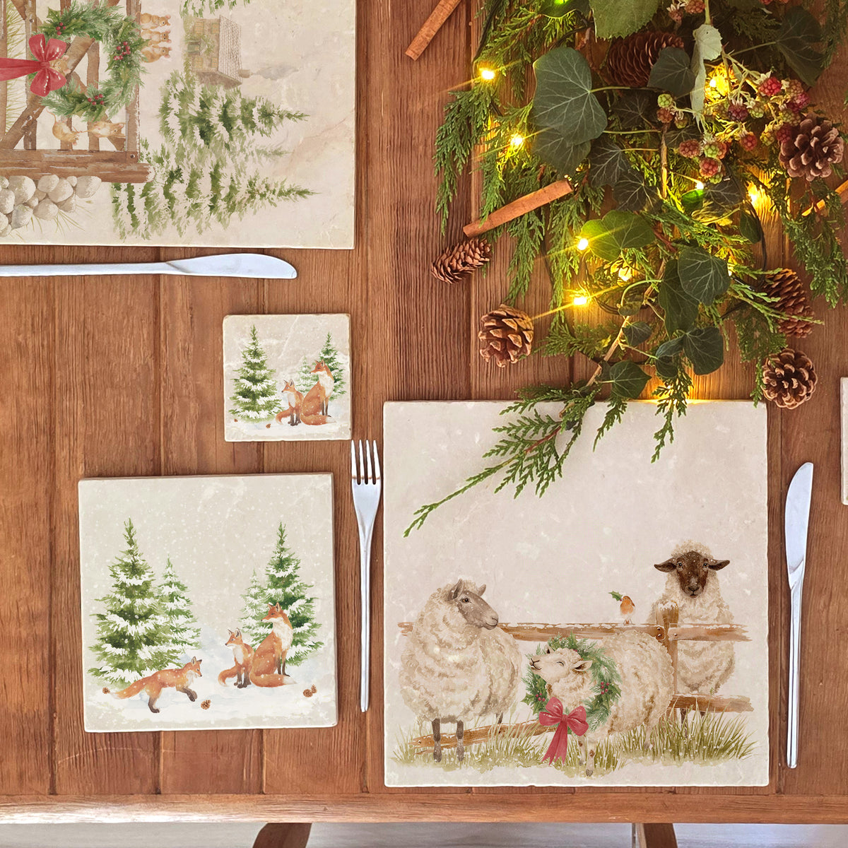 A medium marble platter featuring a forest scene with a family of foxes and fox cubs playing in the snow.