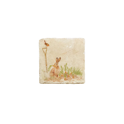 A cream marble splashback tile featuring a watercolour vegetable patch design, with a hare eating carrots and robin sat on a garden spade.