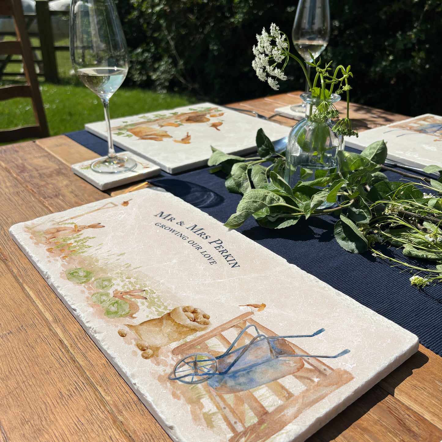 A personalised marble sharing platter with a vegetable patch watercolour design where rabbits and hares are stealing vegetables in the allotment. Create a personalised serving platter, trivet or cheeseboard as a luxury gift.