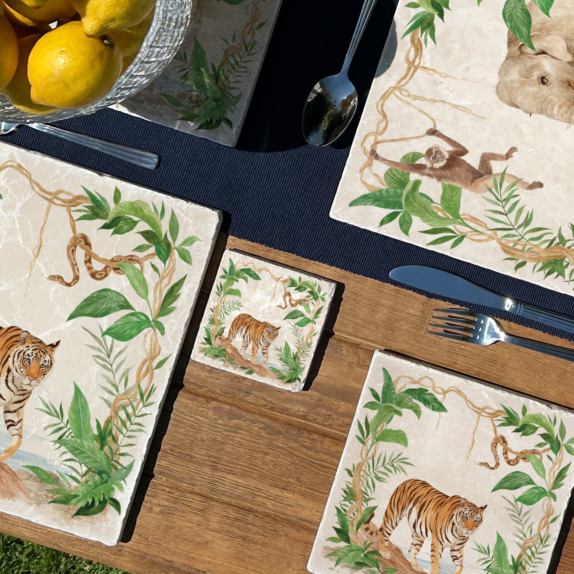 Welcoming our Rainforest Design, surrounded by the rainforest leaves and vines. Capture our Tiger and Python  quietly prowling through the Rainforest, Illustrated in our  original watercolour designs on our set of 4 coasters.