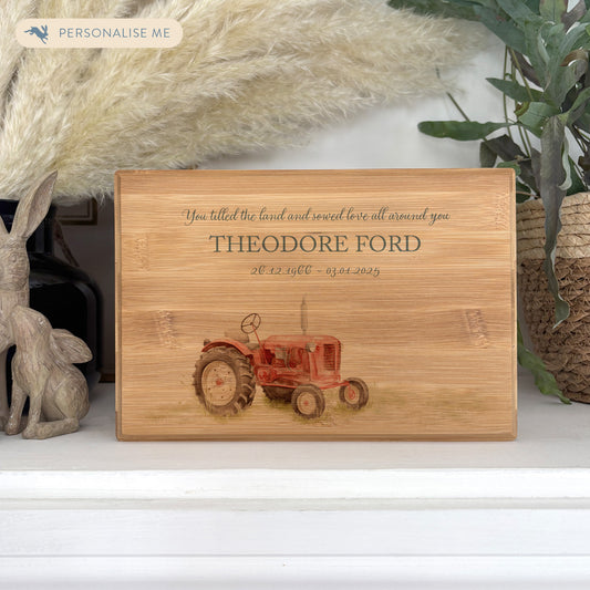 A beautifully crafted solid Bamboo wooden urn, personalised and finished with a soft watercolour design of a Farmers Tractor,  Great for Dad, Grandad, Brother, Son, Uncle.  Thoughtfully made for either display or burial, this personalised urn can be customised to create a meaningful memorial. Perfect for holding ashes of a loved one or a beloved pet, it serves as a comforting tribute and keepsake. 