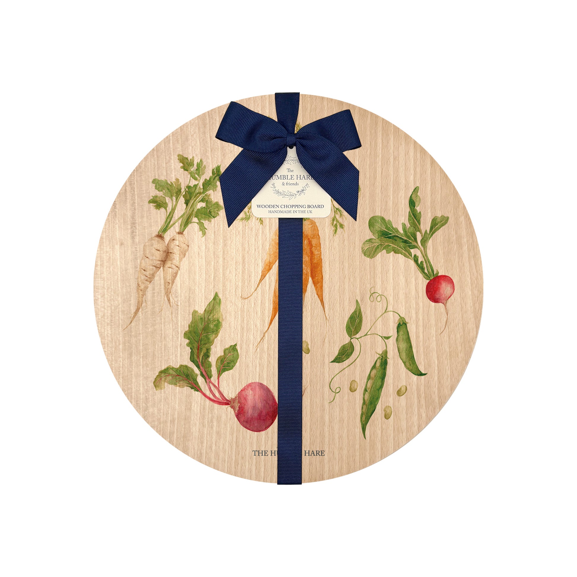 Round beech wood chopping board featuring a watercolour pattern of beetroot, carrots, parsnips, runner beans and radishes. The wooden board is finished with a blue gift ribbon and tag.