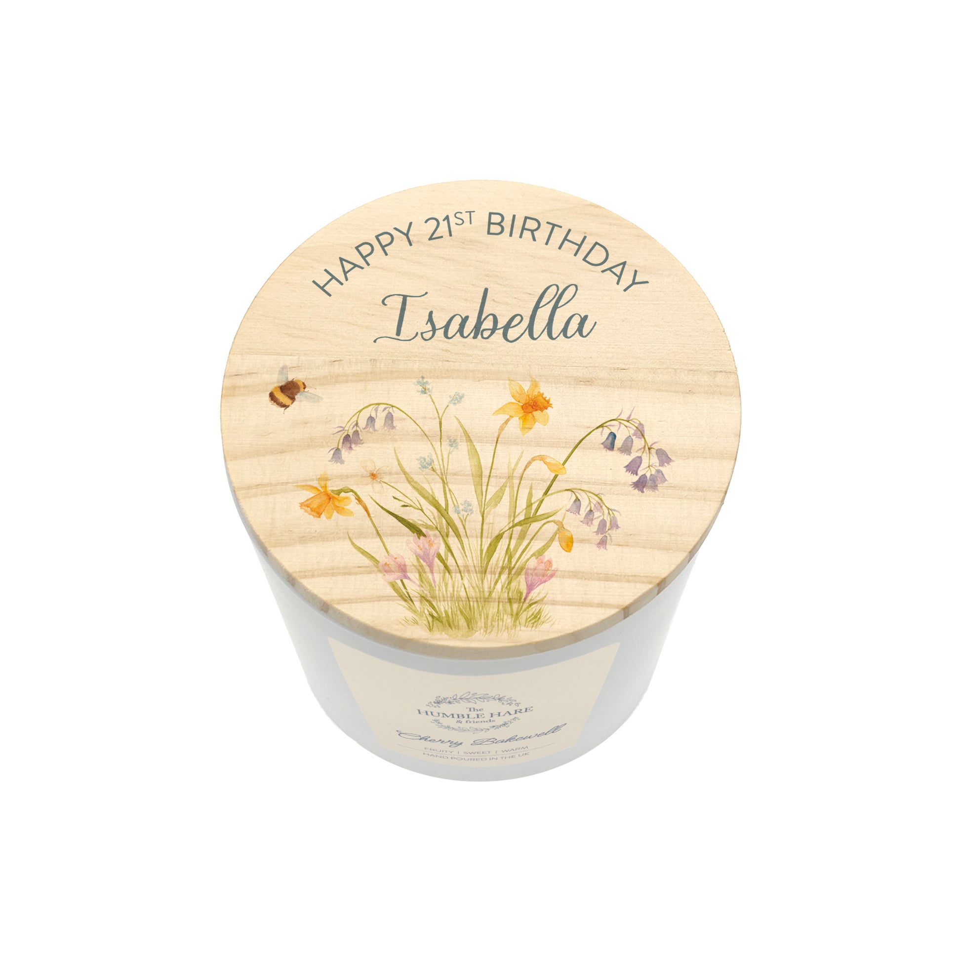 A personalised white glass candle jar with a light wood lid with an illustration of a flowers and the text 'Happy 21st Birthday Isabella'.